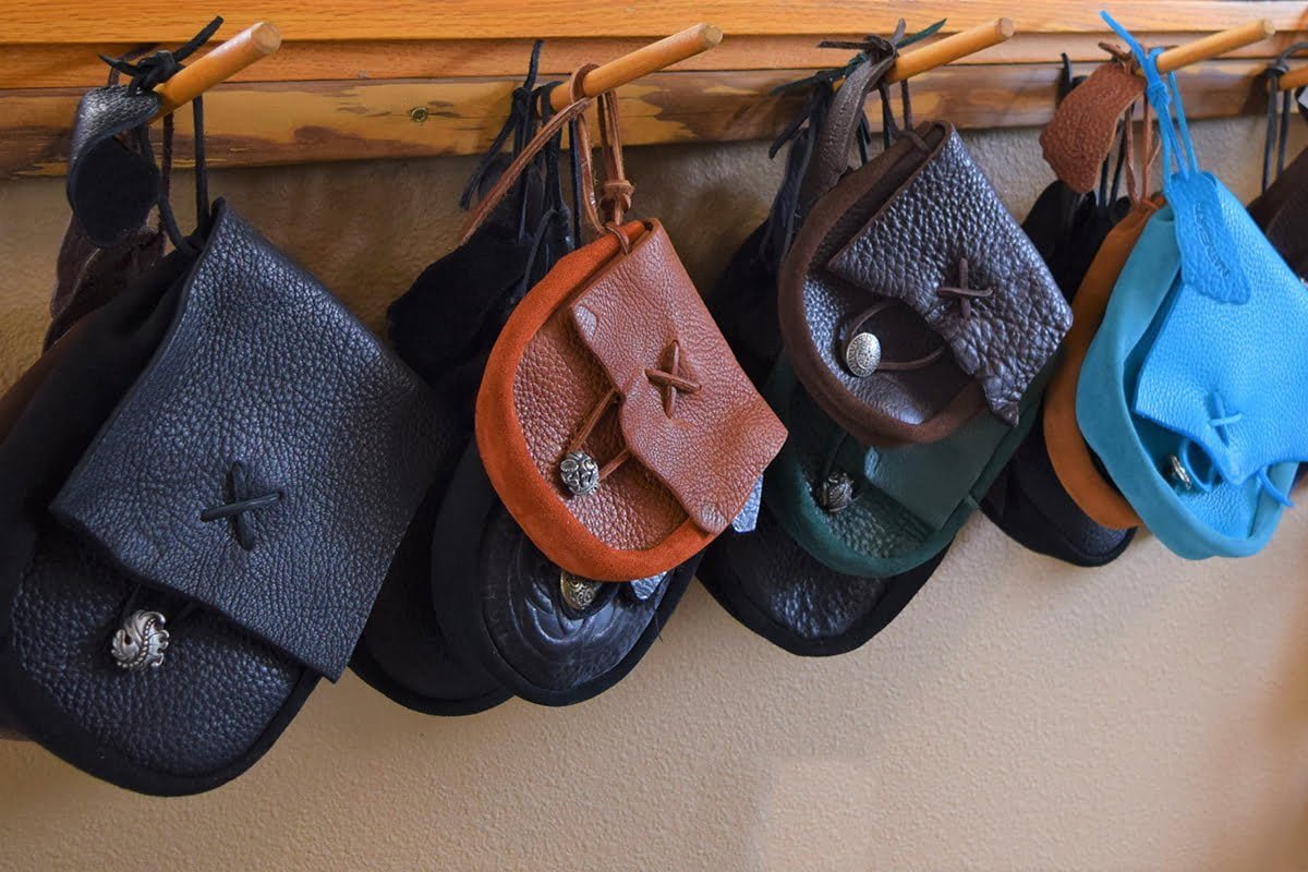 Nativearth handmade leather bags hanging in the workshop