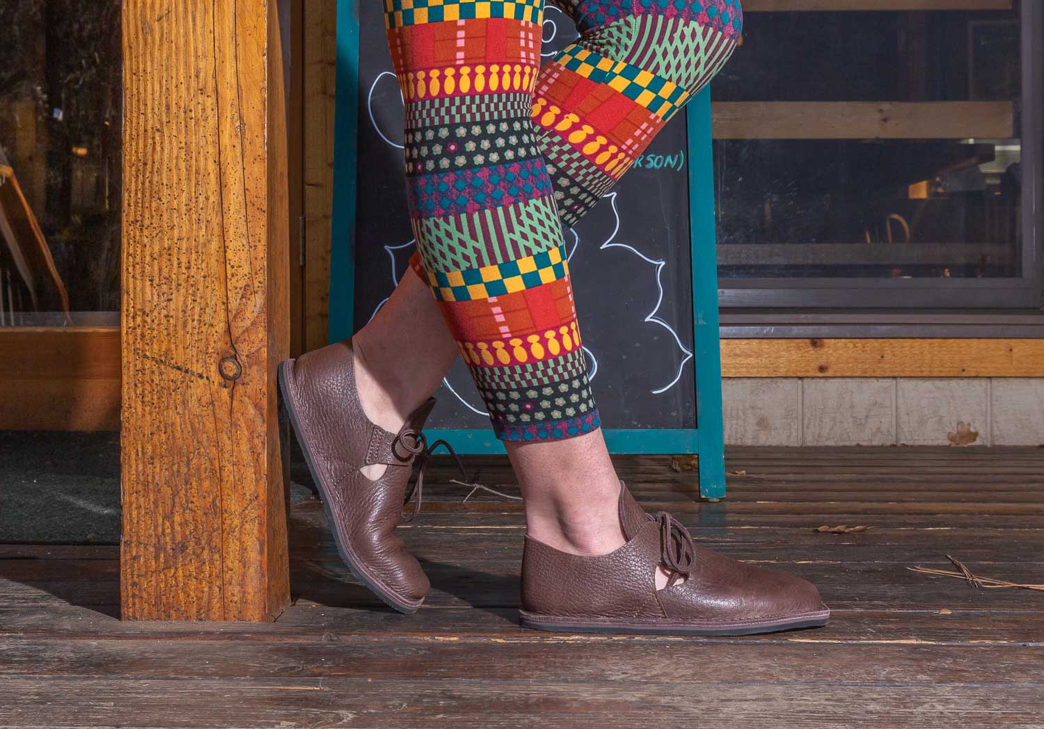Nativearth faire footwear worn with costume clothing